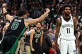 Jayson Tatum #0 of the Boston Celtics celebrates the game winning basket as Kyrie Irving #11 of the Brooklyn Nets looks on during the fourth quarter of Round 1 Game 1 of the 2022 NBA Eastern Conference Playoffs at TD Garden on April 17, 2022 in Boston, Massachusetts. (Photo by Maddie Meyer/Getty Images)