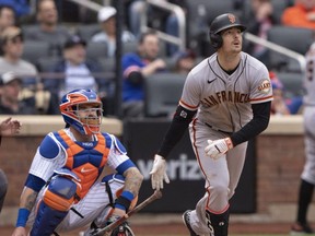 Giants right fielder Mike Yastrzemski hits a home run against the Mets during the eighth inning at Citi Field in New York City, April 21, 2022.