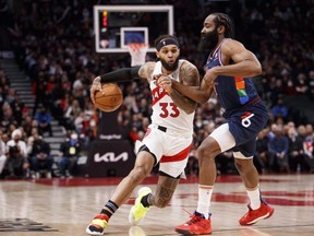 Toronto’s Gary Trent Jr. drives against Philadelphia’s James Harden during Game 6 last night. Harden finally came alive in this playoff series with 22 points, 15 assists and six rebounds to help torpedo the Raptors’ playoff hopes.  Getty Images