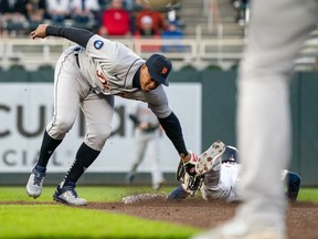 Detroit Tigers second baseman Jonathan Schoop tags out Minnesota Twins left fielder Nick Gordon attempting to steal second base during the fifth inning at Target Field.