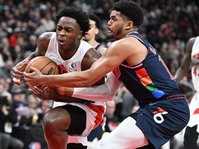 Toronto Raptors forward OG Anunoby has his drive to the basket stopped by Philadelphia 76ers forard Tobias Harris in the second half during game six of the first round for the 2022 NBA playoffs at Scotiabank Arena.