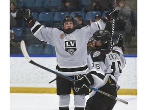 Defenceman Spencer Lecot, left, celebrates with Lee Knight after his goal opened the scoring in Sunday's series finale with the St. Marys Lincolns.