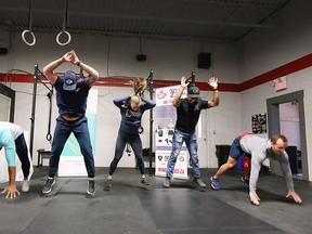 Representatives of the Canadian Mental health Association Windsor-Essex County, Windsor Fire and Rescue Services, Windsor Police Service, Essex-Windsor EMS, and Windsor CrossFit have a burpee battle at Windsor CrossFit on April 29, 2022.