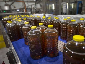Bottles of Pine-Sol are seen during manufacture while a funding announcement was made by Helena Jaczek, Minister of the Federal Economic Development Agency for Southern Ontario, Thursday, April 21, 2022.