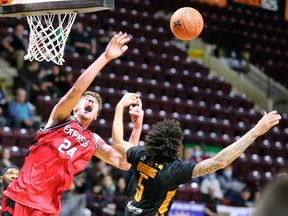 Windsor Express forward Tanner Stuckman, left, battles the Sudbury Five's Jeremy Harris for a loose ball during Wednesday's game at the WFCU Centre.