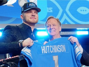 Michigan defensive end Aidan Hutchinson with NFL commissioner Roger Goodell after being selected as the second overall pick to the Detroit Lions during the first round of the 2022 NFL Draft at the NFL Draft Theater.