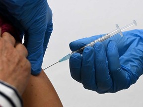 A dose of COVID-19 vaccine is administered in this November 2021 file photo from Sonthofen, Germany.