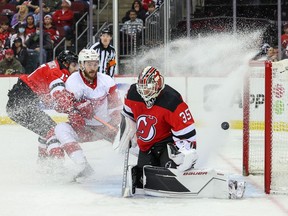 New Jersey Devils goaltender Andrew Hammond makes a save against the Detroit Red Wings during the third period at Prudential Center.