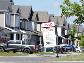 A realtor's 'sold' sign outside a house in Ottawa.