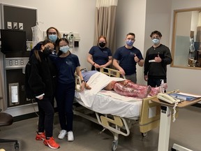 University of Windsor nursing peer mentors finish the moulage for the third-year burn scenario in the faculty’s simulation lab. SUPPLIED