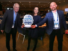 Canadian hockey broadcasting icon Ron MacLean, left, poses with Play For A Cure organizers Diletta Bello Casey and Jeff Casey at the St. Clair Centre for the Arts in Windsor on Thursday, April 7, 2022.