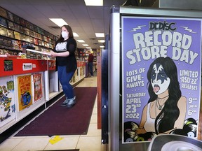 Aimee Charette, store manager of Dr. Disc Records in downtown Windsor, stands near a poster promoting Record Store Day on April 23. Photographed April 20, 2022.