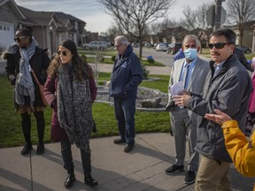 Barry Horrobin, right, director of planning and physical resources with the Windsor Police Service, leads a group of interested parties on a walkabout assessment in the area of Northwood Public School, on Wednesday, April 20, 2022.