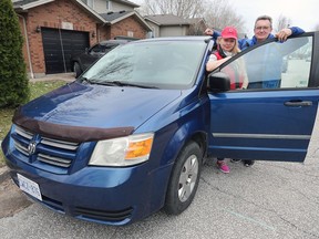 Olga and Volodymyr Petrenko pose with a minivan that was gifted to them recently. The Ukrainian couple left their war torn country about a month ago. They are living with their daughter in LaSalle.