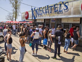 Long lineups were commonplace at restaurants - including Knechtels on Walker Street - during the Friday the 13th gathering in Port Dover. OPP estimated more than 100,000 people had descended on the lakeside community by mid-day, with more expected to arrive. Photograph taken Friday, May 13, 2022. (Brian Thompson/Postmedia Network)