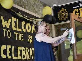 Michelle Holden, class of 1986, takes a selfie with daughter Raelyn Bastien at General Amherst High School on Saturday, May 14, 2022. The school held an open house on Saturday to mark its 100th anniversary and the school's closing this summer.