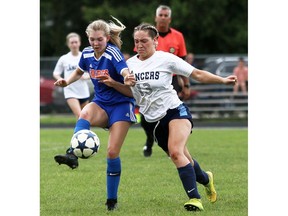Sandwich Sabres' Zola DeGraw, left, battles Ursuline Lancers' Brooklyn during the SWOSSAA girls' AAA soccer final.DeGraw will pull double duty with soccer and track and field this week.
