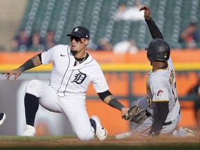 Shortstop Javier Baez of the Detroit Tigers tags out Ke'Bryan Hayes of the Pittsburgh Pirates trying to steal second base during the seventh inning of Game Two of a doubleheader at Comerica Park on May 4, 2022, in Detroit, Michigan.