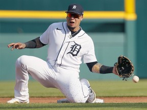 Shortstop Javier Baez #28 of the Detroit Tigers can't reach the pickoff throw, allowing Sheldon Neuse of the Oakland Athletics to steal second and go on to third base, during the fourth inning of Game Two of a doubleheader at Comerica Park on May 10, 2022, in Detroit, Michigan. Catcher Eric Haase of the Detroit Tigers was given a throwing error on the play.