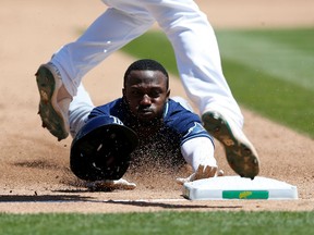 Randy Arozarena of the Tampa Bay Rays steals third base in the top of the sixth inning against the Oakland Athletics at RingCentral Coliseum on May 04, 2022 in Oakland, California.