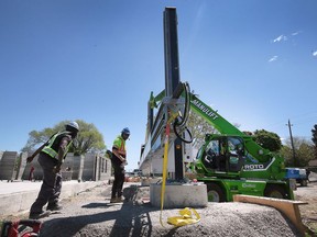 Technicians with nidus3D are shown at the Habitat for Humanity Windsor-Essex multi-unit construction site in Leamington on Tuesday, May 17, 2022.