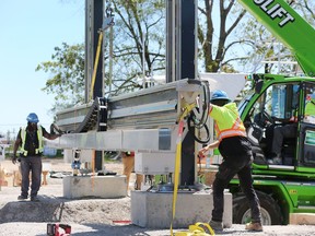 Technicians with nidus3D are shown at the Habitat for Humanity Windsor-Essex multi-unit construction site in Leamington on Tuesday, May 17, 2022.