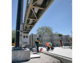 Technicians with nidus3D are shown at the Habitat for Humanity Windsor-Essex multi-unit construction site in Leamington on Tuesday, May 17, 2022.