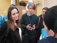 Angelina Jolie listens while meeting with volunteers during a visit to Lviv's main railway station, amid Russia's invasion of Ukraine, Saturday, April 30, 2022 in this still image obtained from handout video.