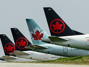 Grounded Air Canada planes sit on the tarmac at Pearson International Airport during the COVID-19 pandemic in Toronto on April 28, 2021.