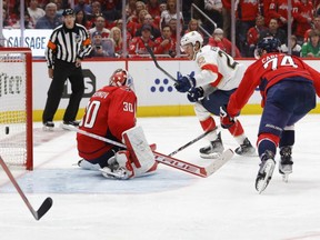 Panthers centre Carter Verhaeghe (centre) scores the game-winning goal on Capitals goaltender Ilya Samsonov in overtime in Game 6 of the first round of the 2022 Stanley Cup Playoffs at Capital One Arena in Washington, D.C., Friday, May 13, 2022.