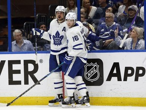 Maple Leafs center Auston Matthews (34) is congratulated by right wing Mitchell Marner (16) after scoring a goal against the Tampa Bay Lightning in Game 6.