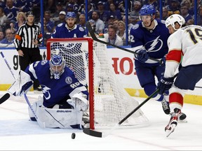 Tampa Bay Lightning goaltender Andrei Vasilevskiy defends the puck from Florida Panthers centre Joe Thornton during the second period at Amalie Arena in Tampa, Fla., May 23, 2022.