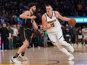 The NBA named Nuggets centre Nikola Jokic (right) league MVP for the second straight season, Wednesday, May 11, 2022.