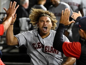 Cleveland Guardians right fielder Josh Naylor (22) celebrates in the dugout after hitting a three-run home run against the Chicago White Sox during the eleventh inning at Guaranteed Rate Field in Chicago, May 9, 2022.
