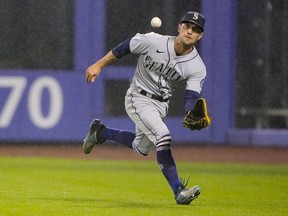 Seattle Mariners right fielder Adam Frazier catches a fly ball hit by New York Mets third baseman Eduardo Escobar (not pictured) during the eighth inning at Citi Field.