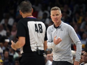 Golden State Warriors head coach Steve Kerr (right) motions to an official during game two of the second round for the 2022 NBA playoffs against the Memphis Grizzlies at FedExForum in Memphis, Tenn., on May 3, 2022.
