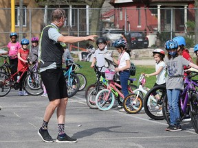 Rob Thibert, with Bike Windsor Essex gives tips to students at King Edward Public School in Windsor during a bike safety session on Tuesday, May 10, 2022.