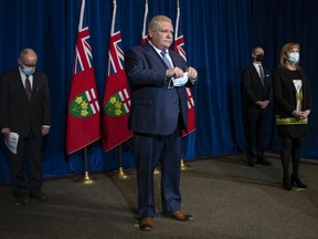 Ontario Progressive Conservative leader Doug Ford gave folksy updates on the pandemic, often flanked by Health Minister Christine Elliot.