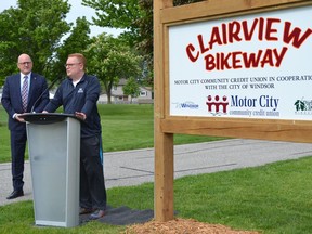 Windsor Mayor Drew Dilkens, left, looks on as Motor City Community Credit Union chief executive Rob Griffith outlines the credit union’s five-year financial commitment to improve to the Clairview Bikeway Trail on the city’s east side, Wednesday, May 25, 2022.