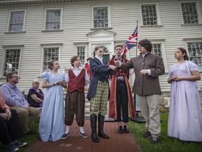 Members of the Riverfront Theatre Company perform 'The Birth of Sandwich' during an event celebrating the lease agreement between the City of Windsor and the Ontario Heritage Trust which will provide for regular public access to the Duff Baby Mansion, on Wednesday, May 25, 2022.