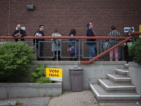 Voters line up to cast a ballot in the Ontario provincial elections in Toronto on Thursday, June 7, 2018.