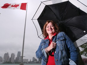 Mary Baruth who was on the Great Canadian Flag Project board poses in front of the downtown Windsor landmark on Wednesday, May 18, 2022. The flag was installed five years ago this week.