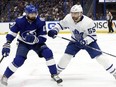 May 6, 2022; Tampa, Florida, USA; Toronto Maple Leafs defenseman Mark Giordano (55) and Tampa Bay Lightning left wing Alex Killorn (17) fight to control the puck during the first period of game three of the first round of the 2022 Stanley Cup Playoffs against the Tampa Bay Lightning at Amalie Arena.