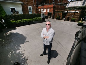 Vito Maggio, owner of Vito's Pizzeria in Walkerville, is shown Tuesday, May 31, 2022, near a section of alleyway behind his restaurant which the city has now approved for permanent patio service space.