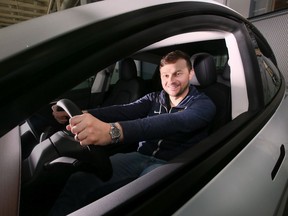 University of Windsor professor Francesco Biondi is shown behind the wheel of a Tesla at the campus on Tuesday, May 17, 2022. Biondi conducted a study on driving habits during the pandemic.