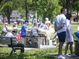 Picnickers enjoy some Ukrainian food during a Ukrainian picnic fundraiser event at Lanspeary Park across from the Ukrainian National Federation on Ottawa Street, on Sunday, May 15, 2022.