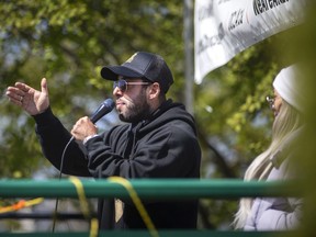 Chris Sky, a prominent figure in Canada's anti-mask and anti-lockdown movement, speaks to a small crowd of a few dozen attending a rally at Dieppe Park, on Saturday, May 7, 2022.