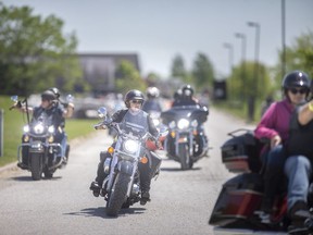 Participants in the Ride for Dad leave Wolfhead Distillery and Restaurant as they make their way through Essex County, on Sunday, May 29,  2022.  The annual motorcycle fundraiser raises money to fight prostate cancer.