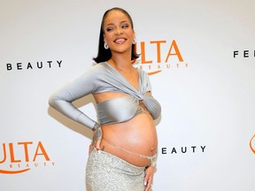 Rihanna shows off her baby bump at the Fenty Beauty launch in March 2022.