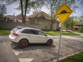A vehicle drives over a speed bump on Bartlet Drive in South Windsor, on Thursday, May 12, 2022.